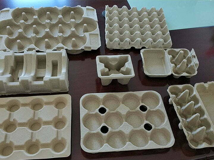 divers plateaux en pâte à papier fabriqués par la ligne de production de plateaux à œufs